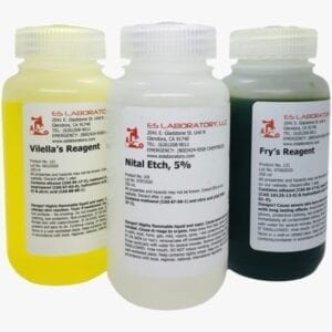 Three bottles of etching chemicals in different colors